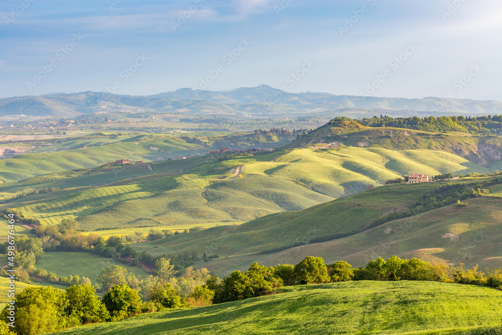 Tuscan countryside rolling landscape view with valleys and fields