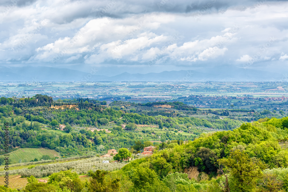 Tuscan countryside landscape with rain clouds