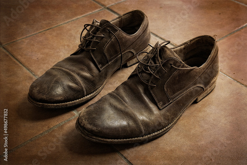 Old brown leather men shoes closeup