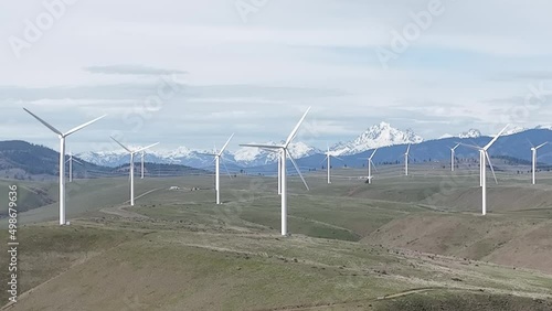 Cinematic 4K aerial drone dolly out shot of Horizontal Axis Wind Turbines, windmills, modern wind turbines in Western Washington state near Ellensburg, Kittitas County on the foothills photo