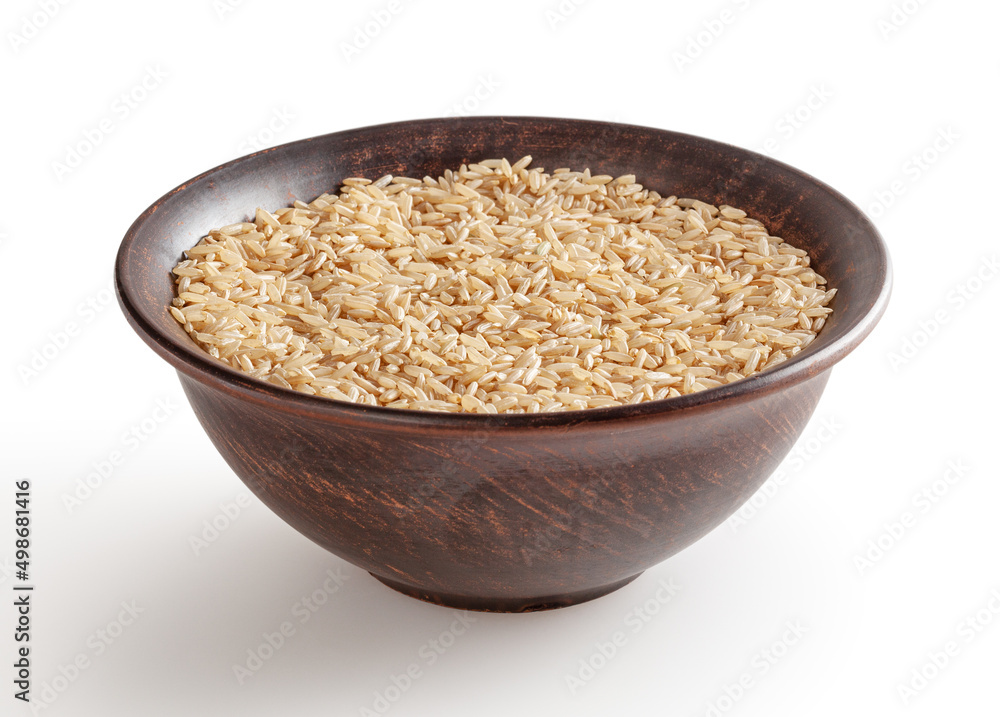 Brown rice in ceramic bowl isolated on white background with clipping path Brown rice in ceramic bowl isolated on white background with clipping path