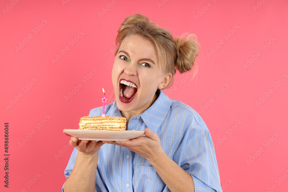 Concept of Happy Birthday with young woman on pink background Concept of Happy Birthday with young woman on pink background