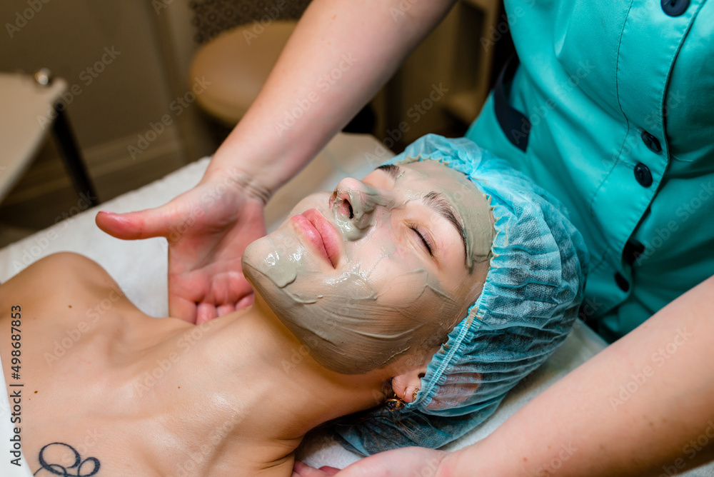 Beautiful young woman having a facial cosmetic treatment. Beautiful young woman having a facial cosmetic treatment.