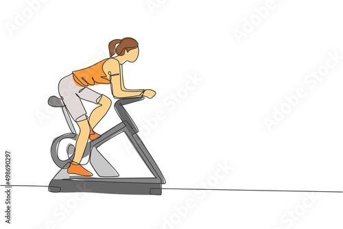 One continuous line drawing of young sporty woman working out static stationary bicycle in fitness gym club center. Healthy fitness sport concept. Dynamic single line draw design vector illustration