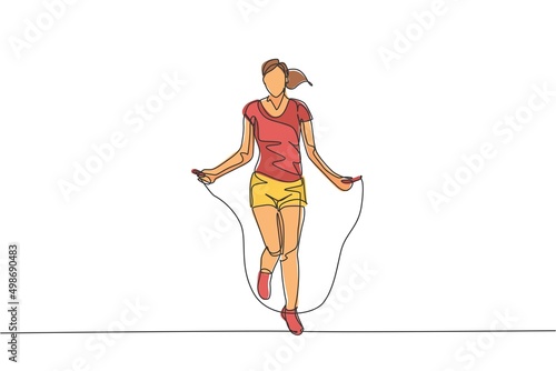 Single continuous line drawing young sportive woman training with jump skipping rope in sport gymnasium club center. Fitness stretching concept. Trendy one line draw design graphic vector illustration