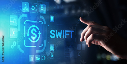 SWIFT international payment system financial technology banking and money transfer concept on virtual screen.