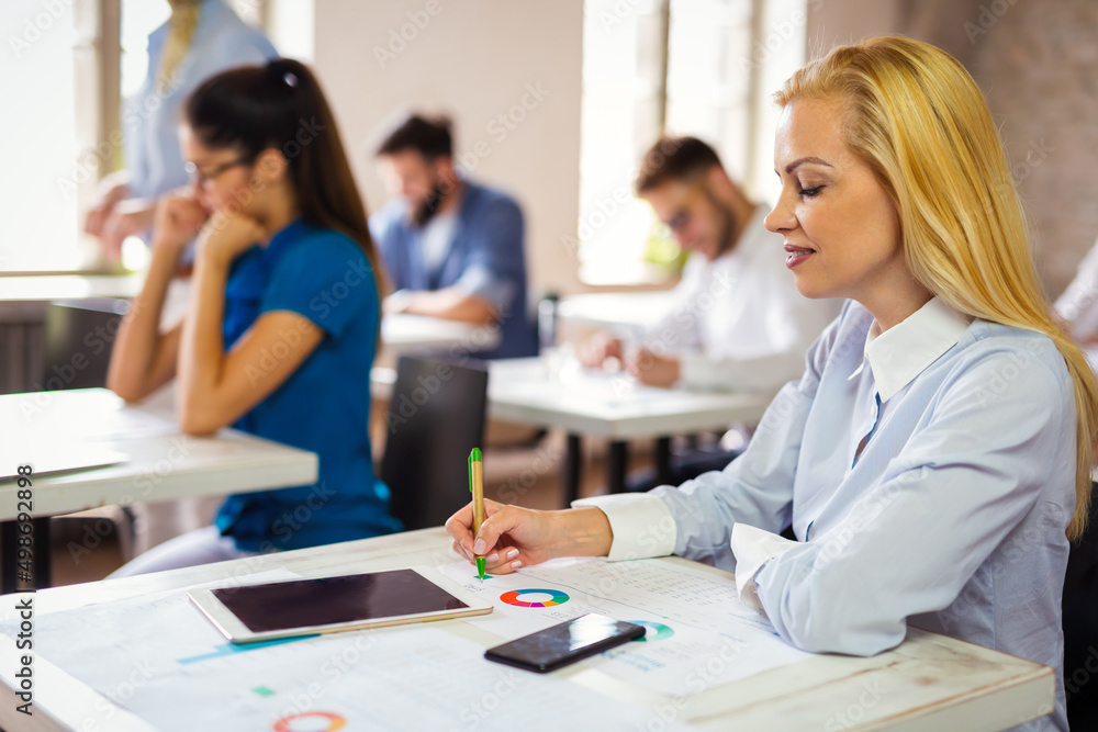 Group of multiethnic business people working at the office. Startup finance teamwork concept Group of multiethnic business people working at the office. Startup finance teamwork concept