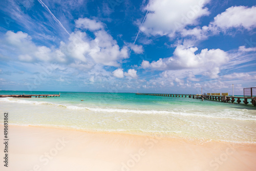 Fototapeta Naklejka Na Ścianę i Meble -  Cancun Mexico beautiful caribbean sea on a sunny day and cloudy sky. sandy beach