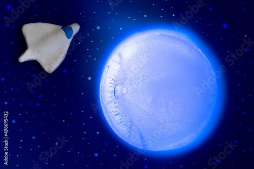 background on the theme of space with an icy planet and a spaceship