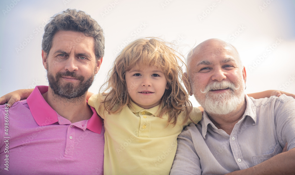 Men generation portrait of grandfather father and son child. Fathers day. Three generations of men together, portrait of smiling boy, dad and granddad. Men generation portrait of grandfather father and son child. Fathers day. Three generations of men together, portrait of smiling boy, dad and granddad.