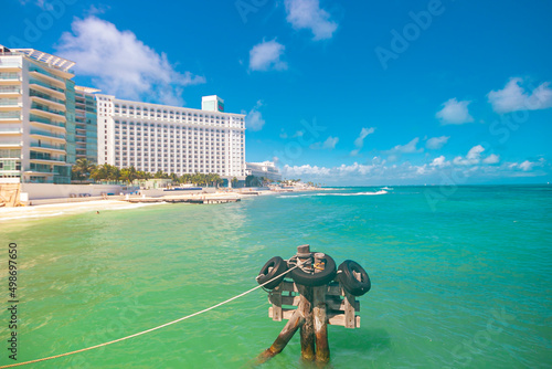 Cancun Mexico beautiful caribbean sea on a sunny day and cloudy sky. Sandy beach