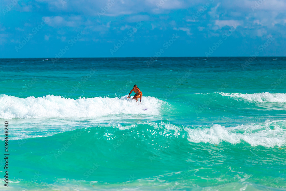 Cancun Mexico beautiful caribbean sea on a sunny day and cloudy sky. Sandy beach