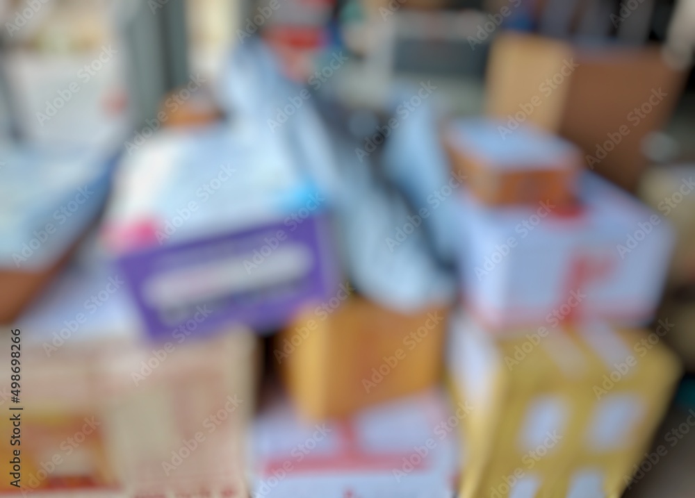Background of overlapping parcel boxes decorated with blur with photo editor.