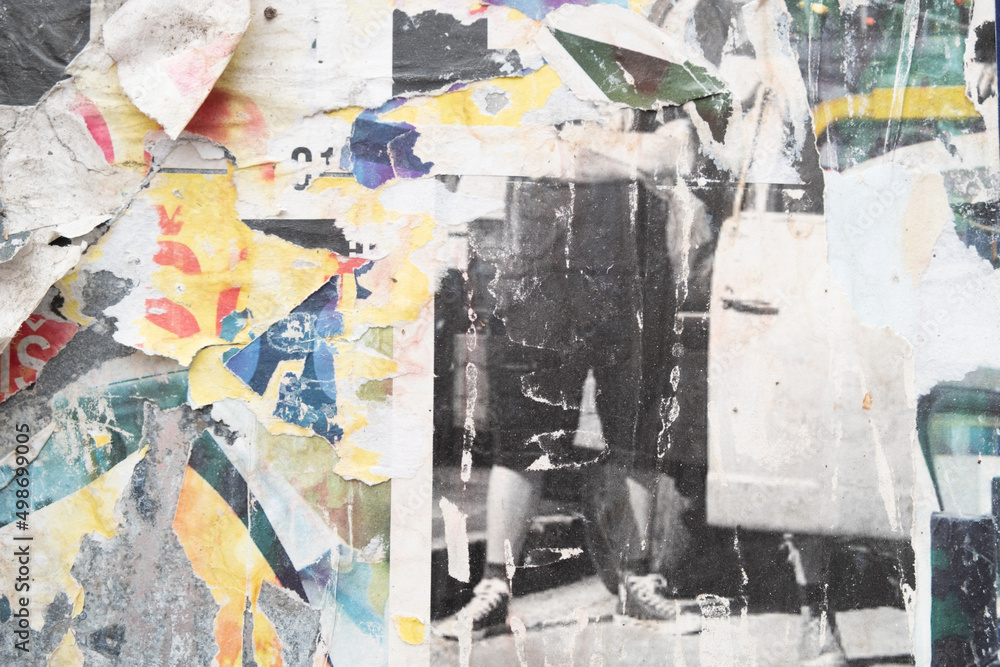 Fototapeta premium Ripped street posters collage on a retro wall background 