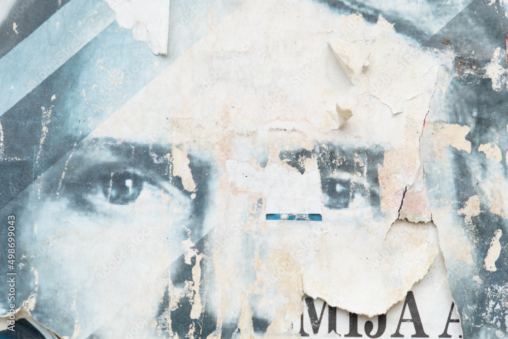 Fototapeta premium Old and weathered blue street poster with a man eyes background