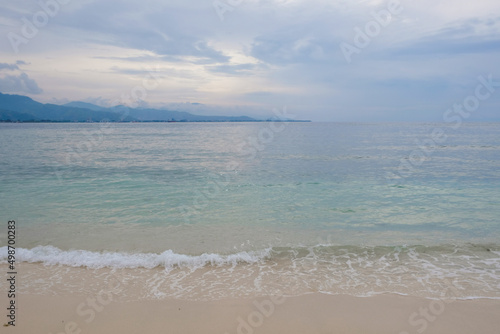 Tropical exotic paradise view of Cristo Rei Beach in Dili, Timor Leste. © renipurnama