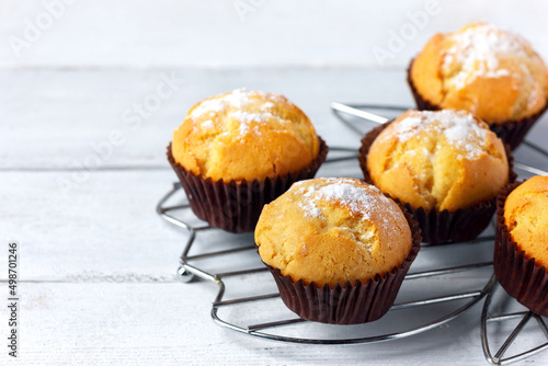 Vanilla muffins on a cooling rack.