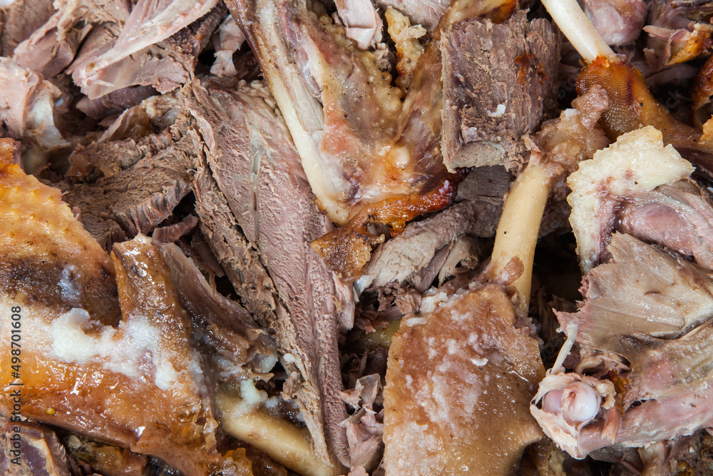 Slices of baked duck at home close-up.