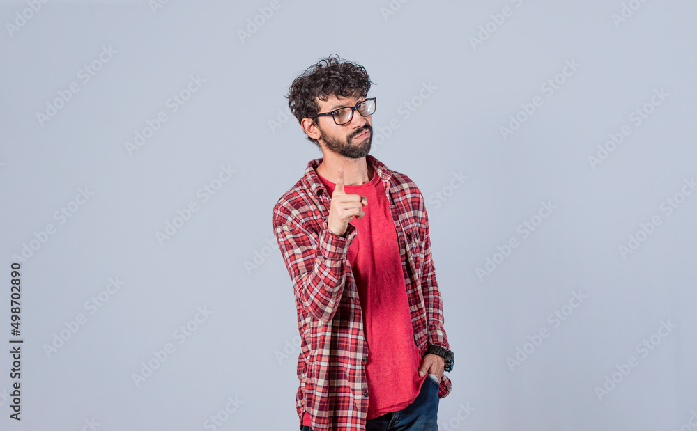 man pointing to the front with his finger, serious man pointing to the front on isolated background, a guy threatening with his finger man pointing to the front with his finger, serious man pointing to the front on isolated background, a guy threatening with his finger