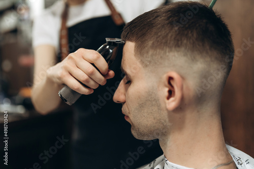 man getting his hair cut at barbershop