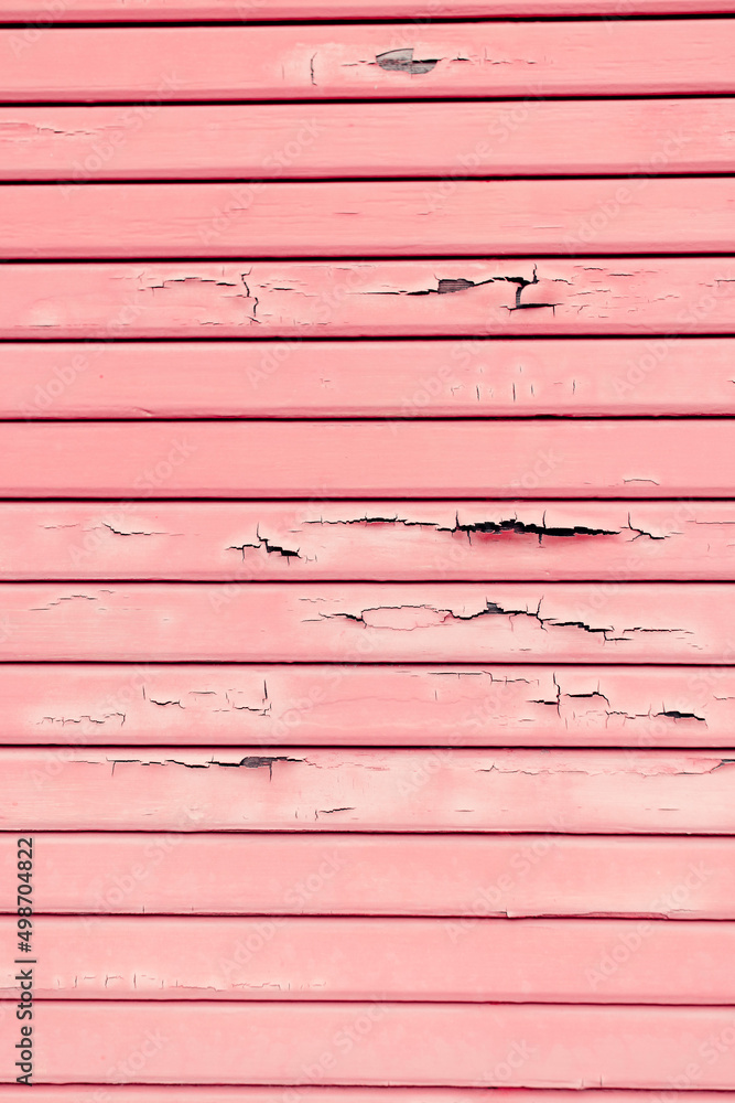 Textured wainscoting wall paneling with chipped and cracked paint chips falling off. Textured wainscoting wall paneling with chipped and cracked paint chips falling off.