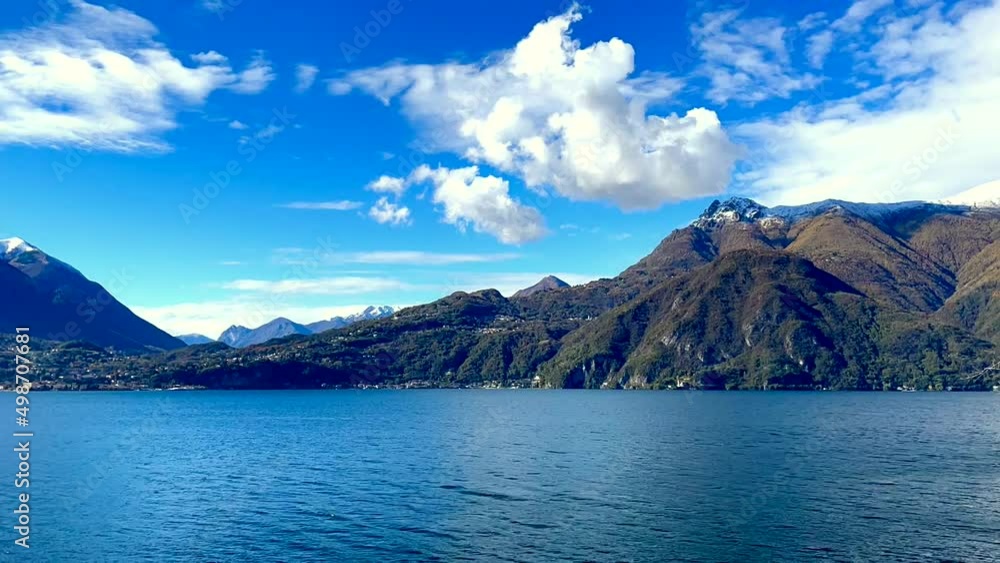 Time-lapse shooting of landscape on lake Como with sky and clouds against background of mountains. Time-lapse shooting of landscape on lake Como with sky and clouds against background of mountains.