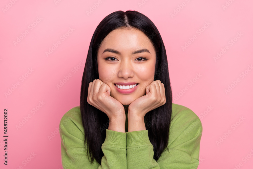Photo of cool millennial lady hands face wear jumper isolated on pink color background Photo of cool millennial lady hands face wear jumper isolated on pink color background
