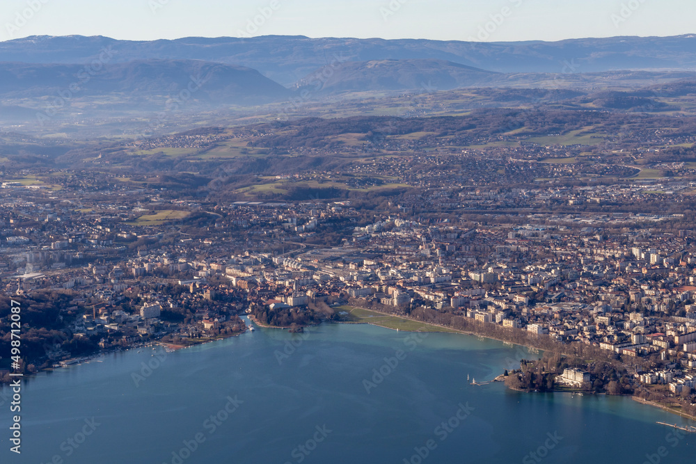 Fototapeta premium Aerial sunrise view of Annecy lake waterfront and old town with landmarks, France