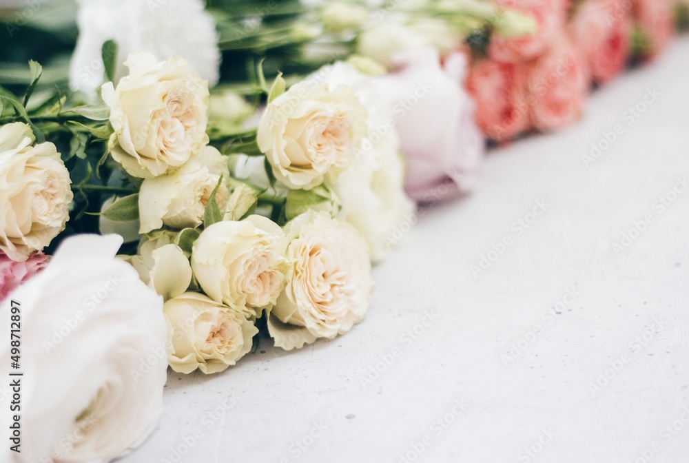 pink roses on grey concrete background. flat lay, top view pink roses on grey concrete background. flat lay, top view