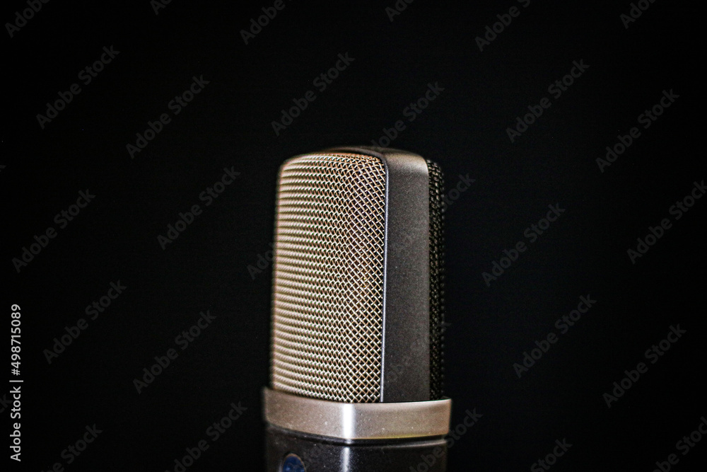 Condenser microphone texture on a black background Condenser microphone texture on a black background