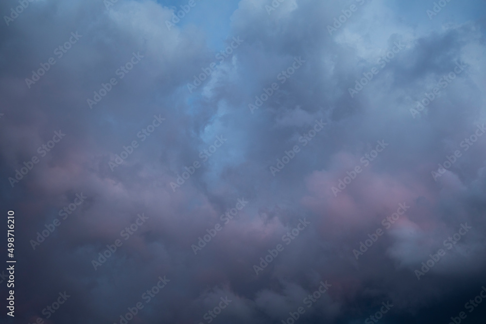 Natural background of dramatic dark stormy colorful clouds