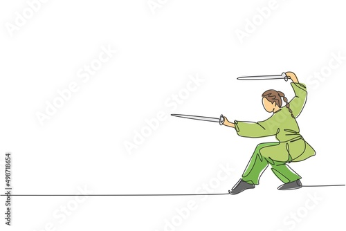 Single continuous line drawing of young woman wushu fighter, kung fu master in uniform training with swords at dojo center. Fighting contest concept. Trendy one line draw design vector illustration