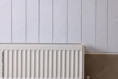 Wallpaper Mural Modern radiator on white wooden wall. Central heating system Torontodigital.ca
