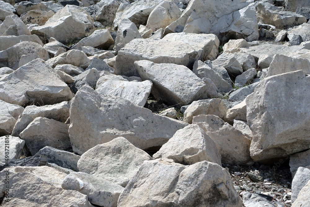 large pieces of rocks placed in front of ponds,