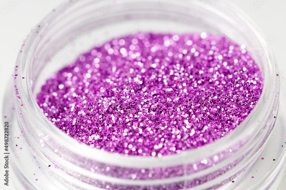 colored sequins in a plastic jar close-up colored sequins in a plastic jar close-up
