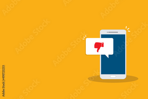 Smartphone with dislike message, dislike button. Thumbs down icon. Social networking, social media usage on mobile device. Flat design vector illustration	