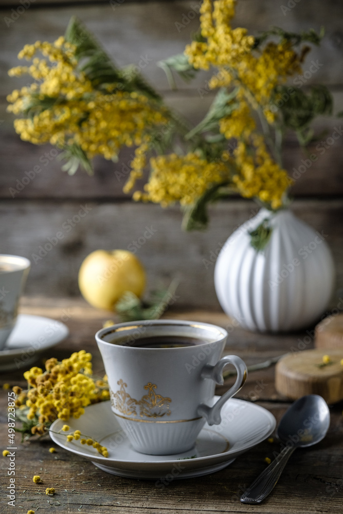 cup of tea and autumn leaves