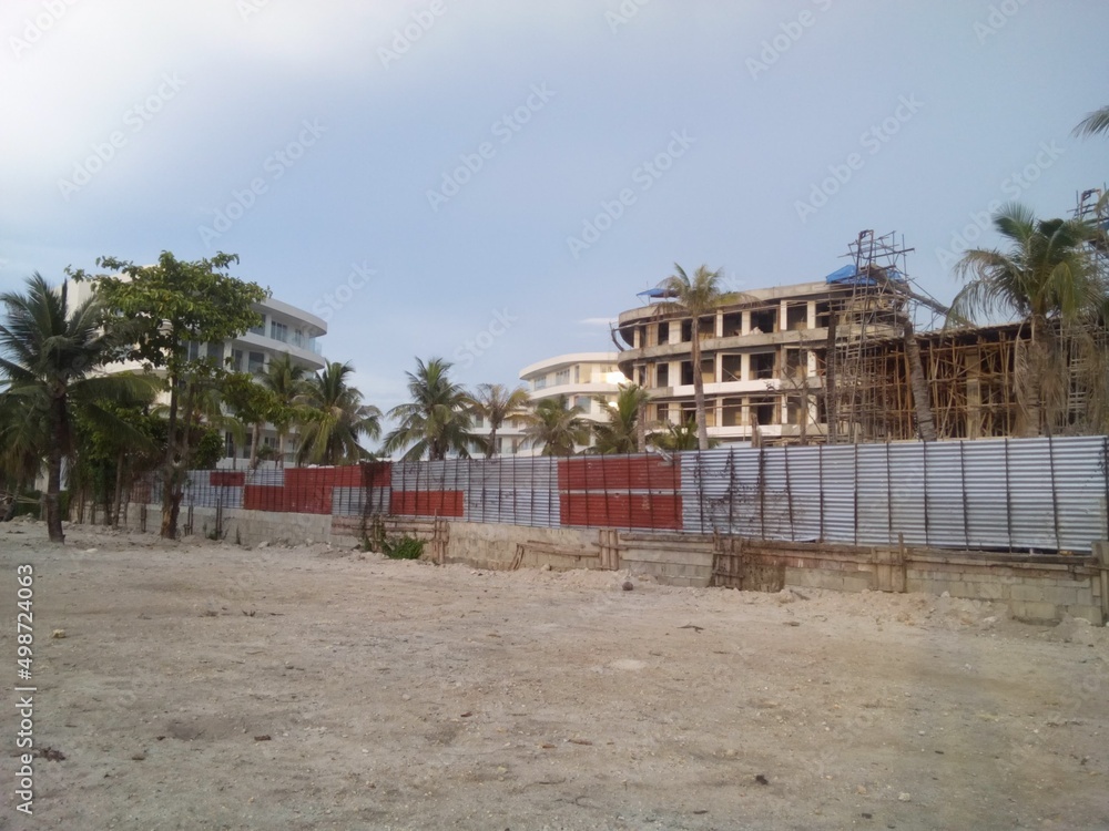 Side view of forth story building in the beach under construction (The Resort Hotel of Aqua Boracay Island Philippines ) Side view of forth story building in the beach under construction (The Resort Hotel of Aqua Boracay Island Philippines )