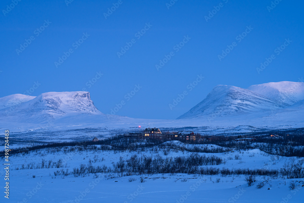 Dusk at the small town of Abisko and the famous Lapporten in winter.