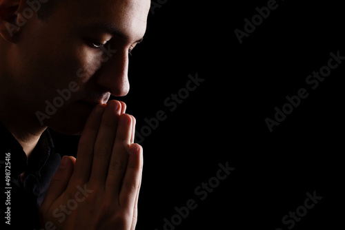 Fototapeta prayer on a dark background