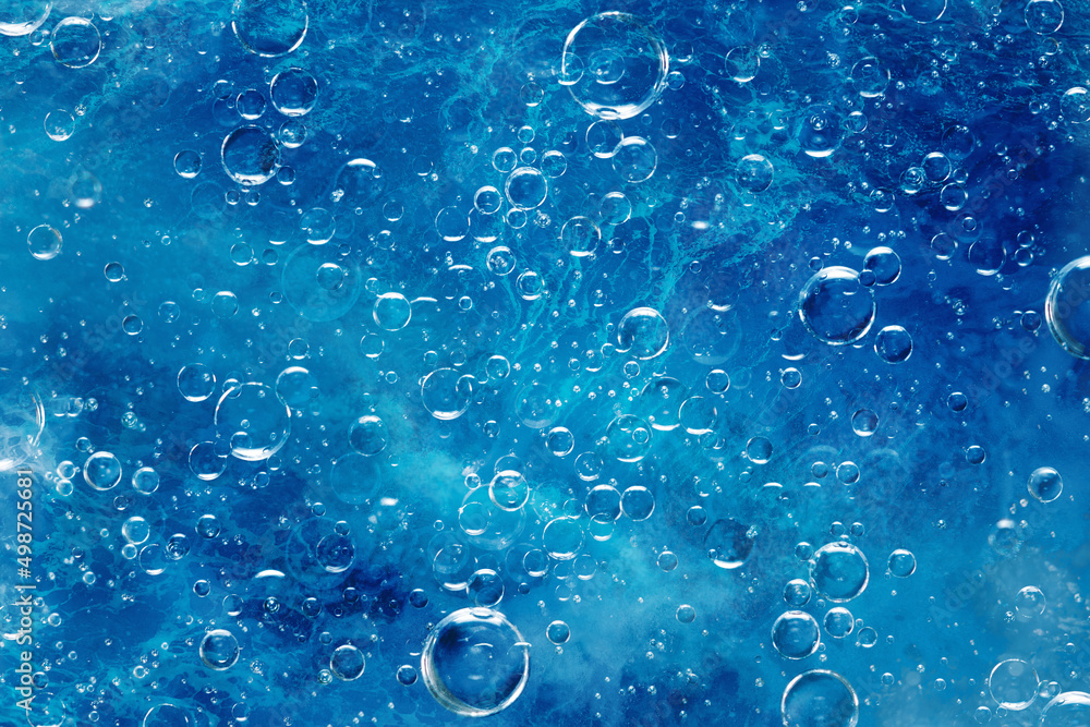 large air bubbles under water, blue background - obrazy, fototapety, plakaty 