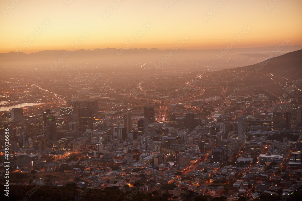 Here comes the sun. Aerial view of a beautiful city at dawn.