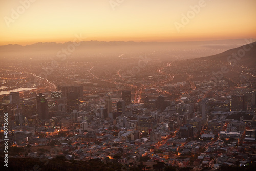 Here comes the sun. Aerial view of a beautiful city at dawn.