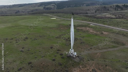 Cinematic 4K aerial drone footage of a Vertical Axis Wind Turbine, windmill, modern wind turbine in Western Washington state near Ellensburg, in the Kittitas County foothills photo
