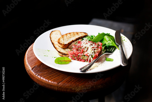 Tartare of beef with spinach.