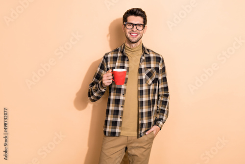 Photo of guy agent finish project done drink aromatic beverage mug isolated over pastel color background © deagreez