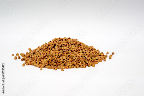 Pile of buckwheat isolated on white background.