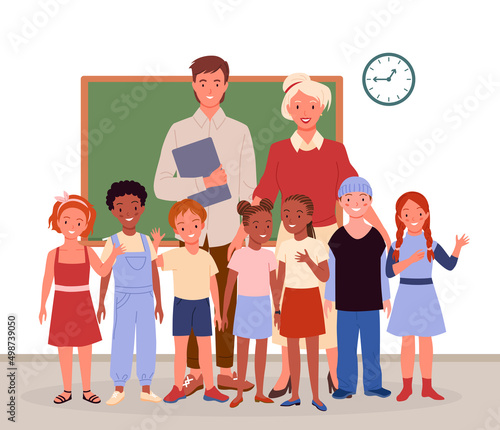 Happy teachers and students children standing in classroom vector illustration. Cartoon female and male teachers with diverse group of girls and boys smiling. Back to school, primary education concept