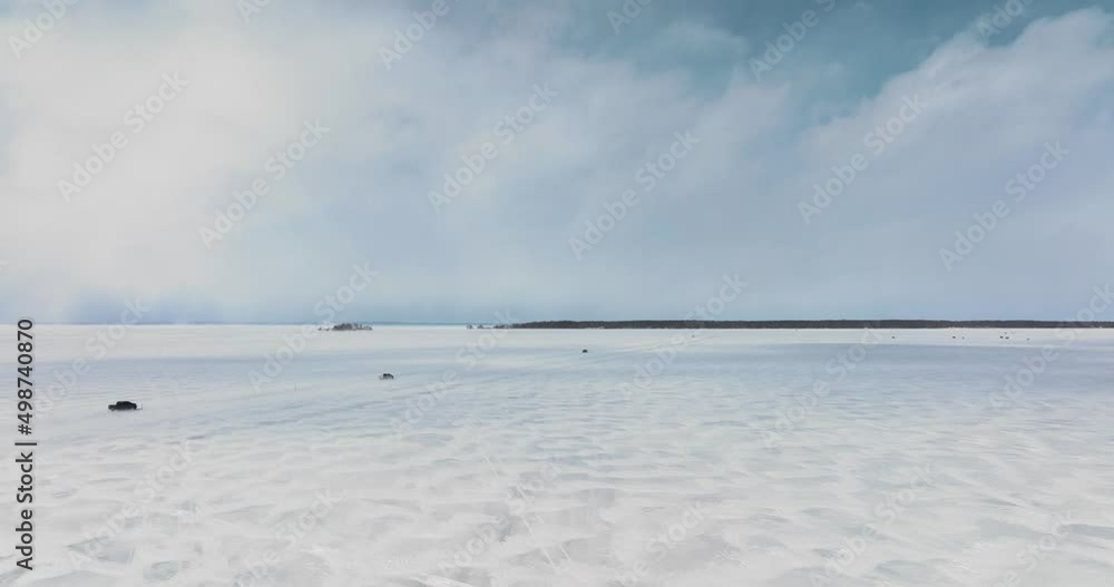 Cars Driving on the frozen lake in Canada, Drone, close to the ground, in 4k Cars Driving on the frozen lake in Canada, Drone, close to the ground, in 4k