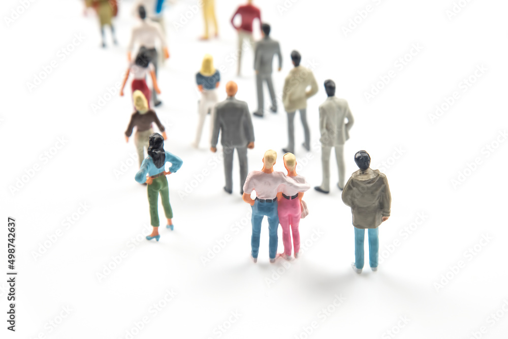 miniature people. different people communicate with each other on a white background miniature people. different people communicate with each other on a white background